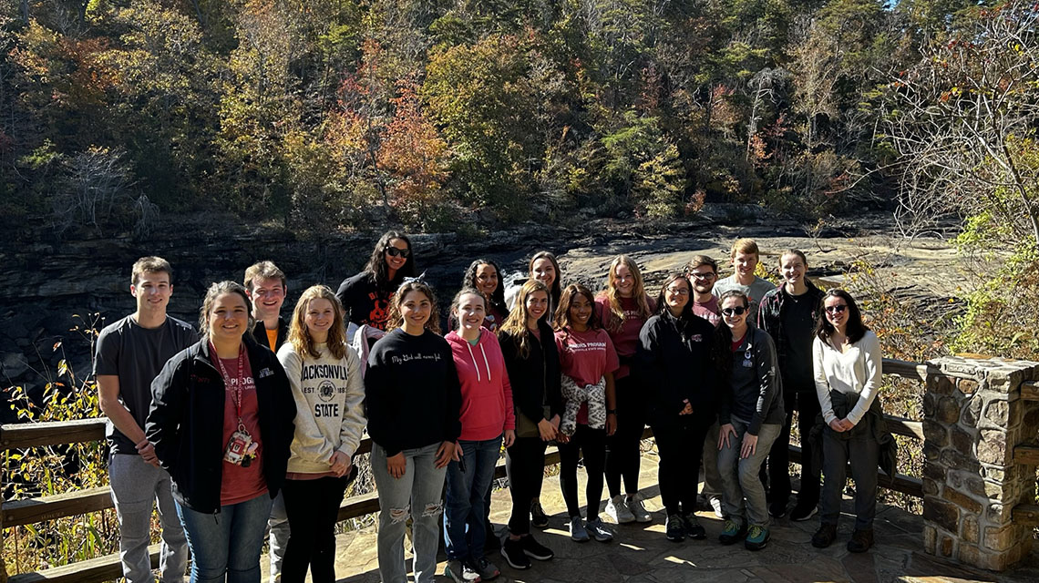 Students stand on the overlook at Little River Canyon Falls.